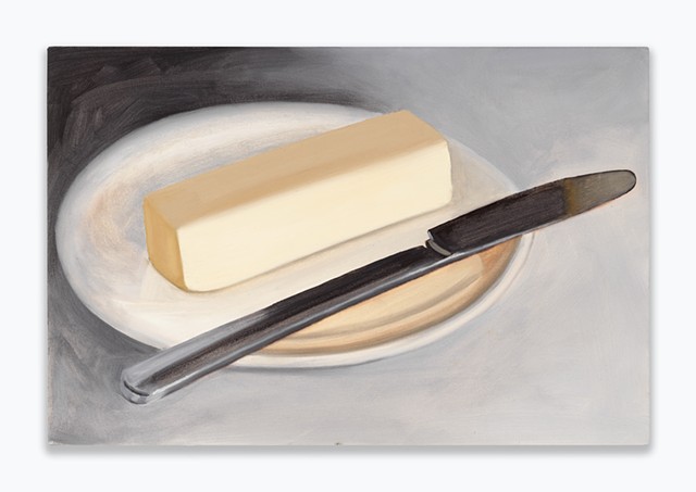 a stick of butter with a knife
