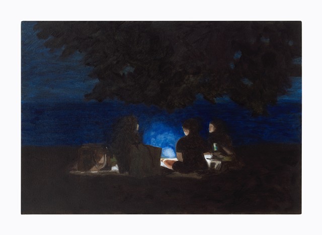 Three women sitting near the lake with a small camp fire and artifical phone light