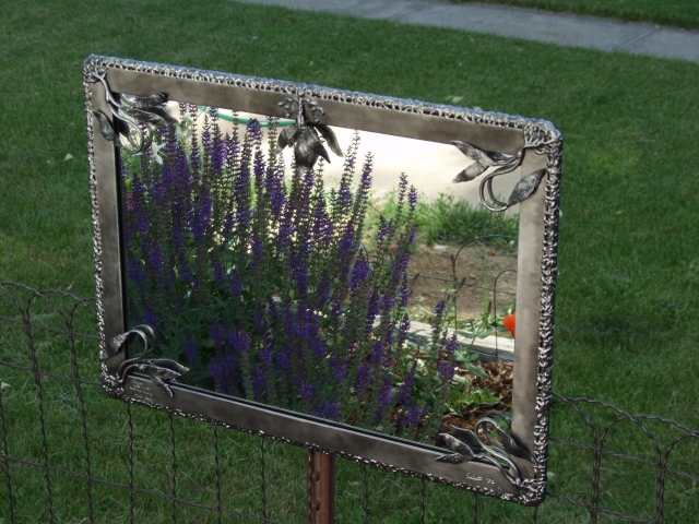 brushed steel mirror with breathing metal detail