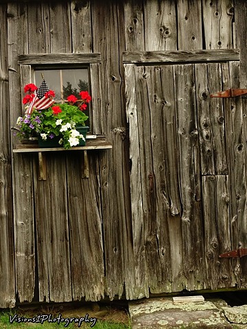 Vermont Barn with Flowers on Window Sill and Old Door Vt.