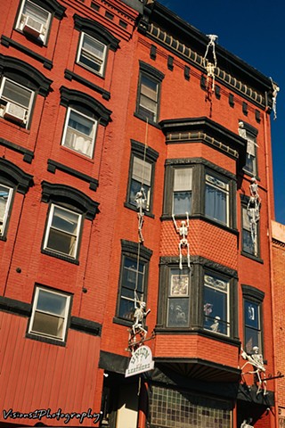 Skeletons Climbing Galena Building (2)