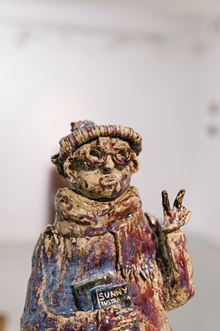 I'm the big bad migrant they warned you about, large stoneware sculpture with glaze and 2ct gold lustre on plinth made by the artist