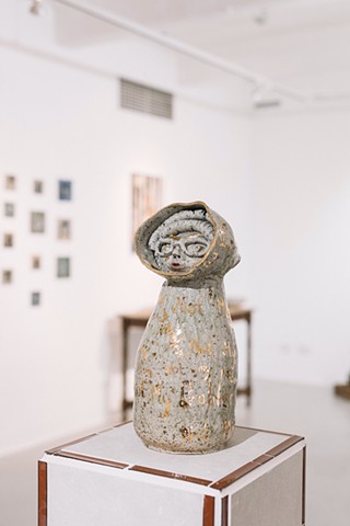 Not My Problem, gas-fired stoneware sculpture with underglaze, glaze and 2ct gold lustre on plinth made by the artist