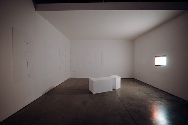 When you enter the gallery, you will find a three-walled room or alcove built into a corner for the installation, “Total Running Time.” The wall on the left is 16 feet long, the center wall is 17 feet long, and the right wall is 12 feet 6 inches long. A d