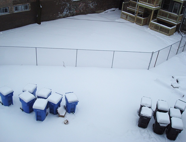 snowy trash and blue bins