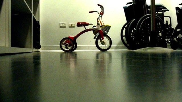 tricycle in the coat check (for william eggleston)