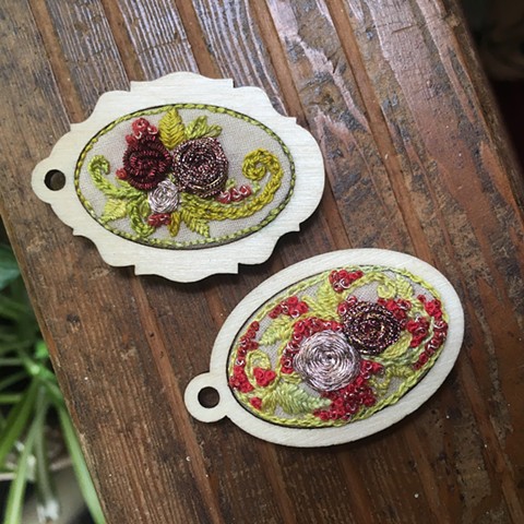 Embroidered flower pendants