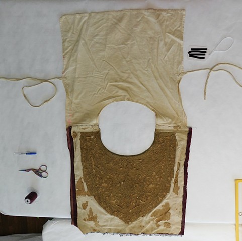 Inside of undershirt before conservation, front and back