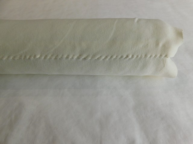 Cotton jersey whip stitched around bolster