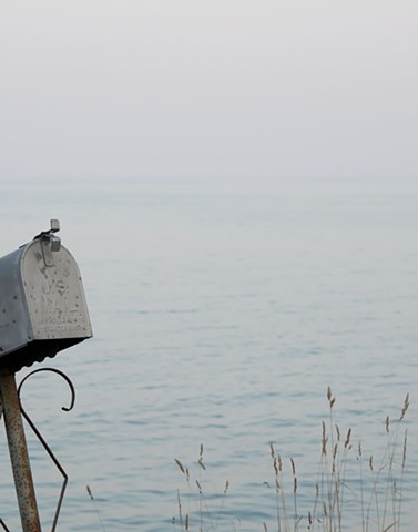 photograph of grasses, mailbox, water; Lake Michigan, Baileys Harbor, Wisconsin; by Colleen E. Gunderson