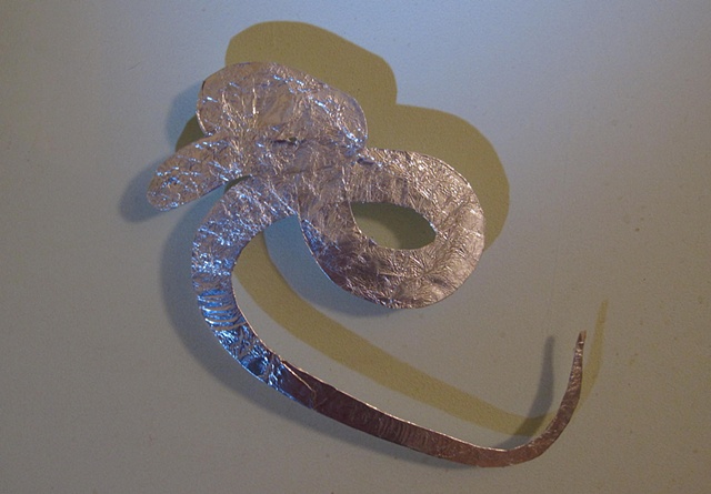 Rat Snake, made from foil found on the street and rhinestone