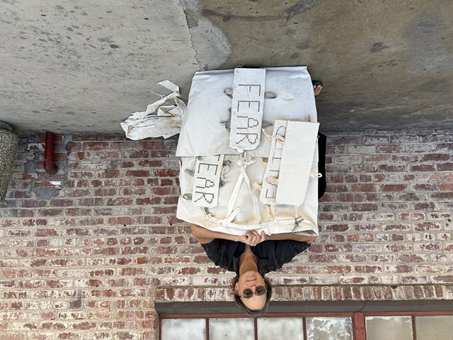 sitting before carrying