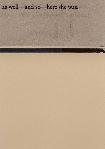 close-up of an edge of a book with faint marks on a plain background