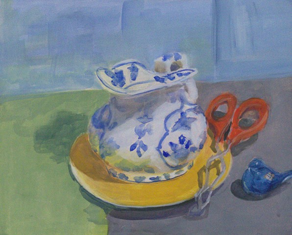 Blue and White Ceramic Pitcher on a Yellow Plate