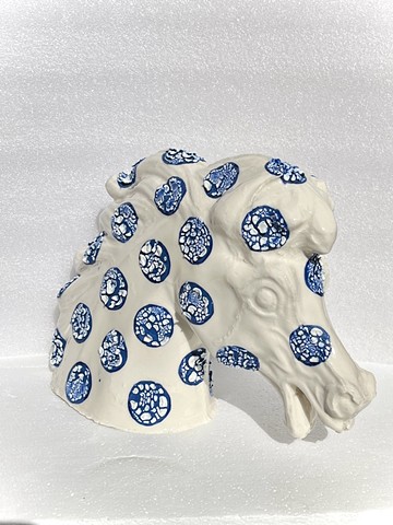 Showgrounds horse head slip cast in a mid fire ceramic slip decorated with blue dots and textured crawl glaze over the dots, then clear gloss glaze over the non painted areas