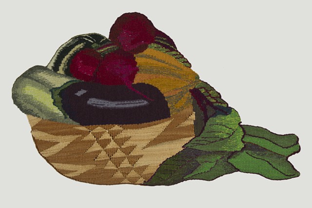 "Simple Abundance" is a shaped, handwoven tapestry of wool, raffia, and cotton. 14 in. x 23.5 in. 