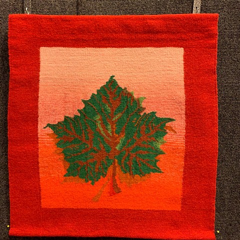"Portrait of a Plane Leaf in Autumn" is a handwoven tapestry of wool on cotton, 20 in. x 24 in. 