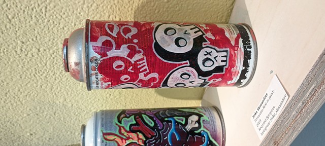 Spray can with skull motif