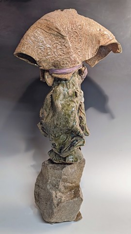 These figures address archetypes, defenders and prophets - spirits that are timeless and in ancient mythologies. Left for us with no arms, or head, incomplete figure, but with the movement and inspired expression - beyond the remnants of the visible. 25" x 8" x 8"  Glazed stoneware, slip-soaked fabric, gold leaf, on stone. 2022