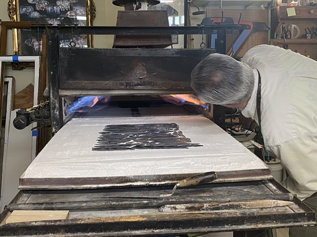 Kevin fires each piece of painted glass to 1200 degrees F. 