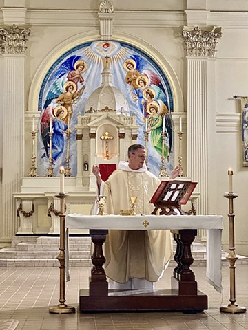 Fr Carl celebrating mass