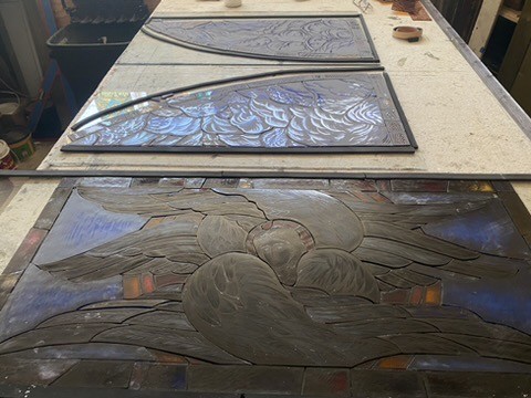 painted panels waiting to be glazed with lead strips