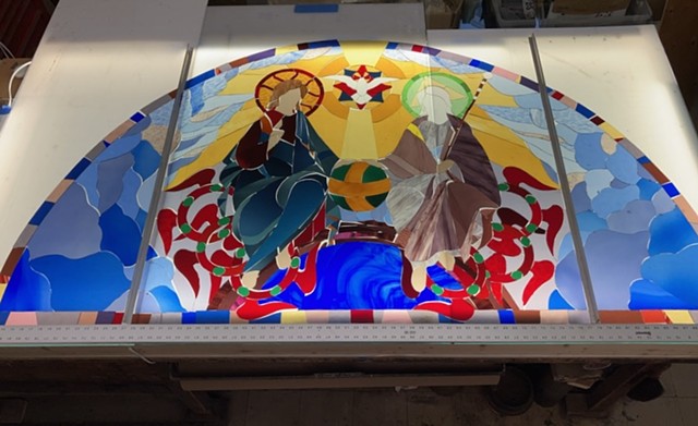 the raw glass has been cut and laid out, ready for painting.