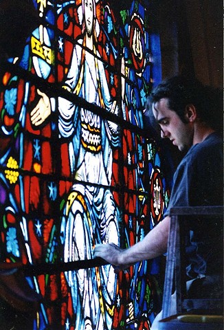 restoring the central rose window of Marsh Chapel, Boston University, while an apprentice at Burnham & Laroche Studio (photo by Kevin Ryan)