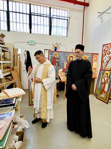Dominican priest Fr. Gregory Liu O.P. and Fr Deacon Kyrill of OLF bless the studio and the murals