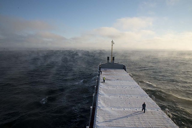 Thule crew continues work on the icy hold surface; From "Majestic Monotony" 