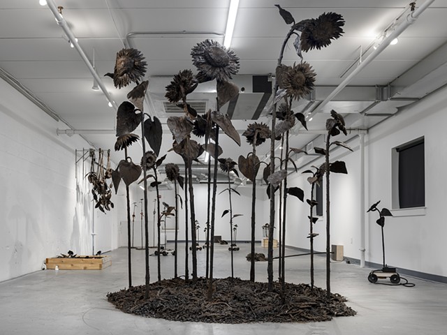 Large Sunflowers, silicon, dirt, steel 2025