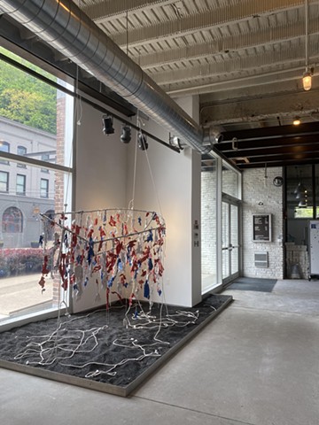 Metal tubing, string, dried paint