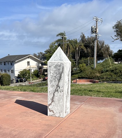 obelisk ambulating towards ruin