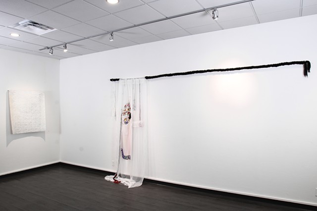 Installation view, held in place