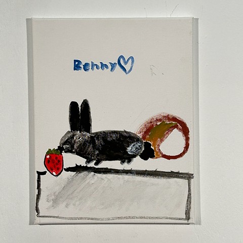 Benny eating a strawberry