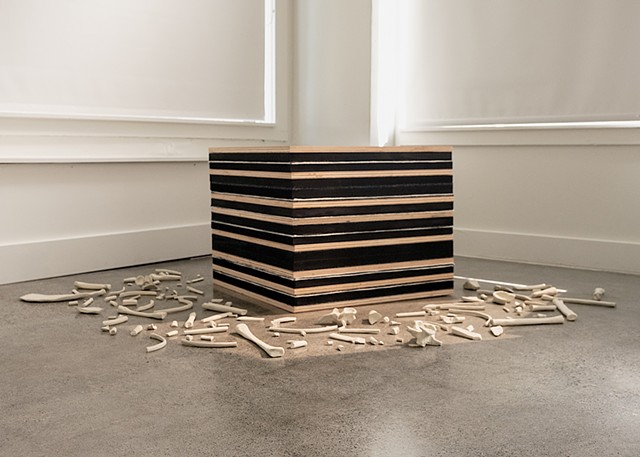 Tomb, 2025, Red oak, wool, polystyrene, ceramic stoneware.