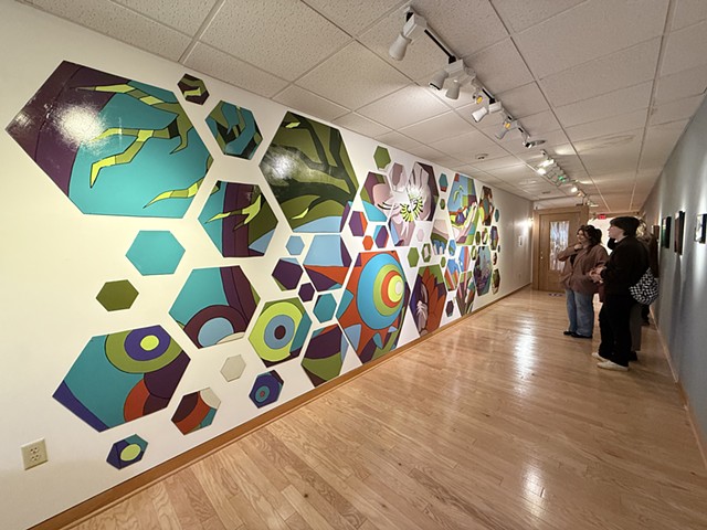 Patrons of the Butler Museum of American Art viewing the "Between Words" Mural