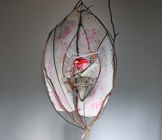 Welded and hand-bent metal, scrap fabric and canvas, foraged branches, citra-solv transfer prints, yarn, thread wire, pomegranate 