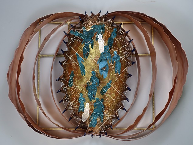 Contemporary sheet copper sculpture with small cutout figures suspended inside