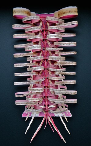 A contemporary wall sculpture made with cut and unfolded paper