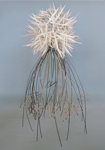 Contemporary sculpture of paper and airplane cable