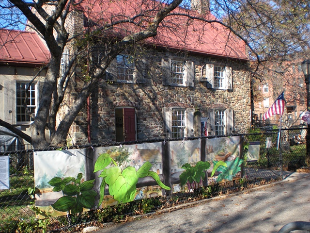 Digitally-printed banners installed on the front fence of the Old Stone House