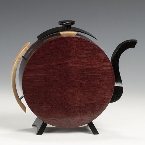  teapot made of exotic wood striking art design.