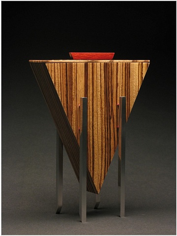 Closed Vessel is a unique sculptural wooden vessel of Zebra Wood, Ebony, Cardinal Wood and metal.
