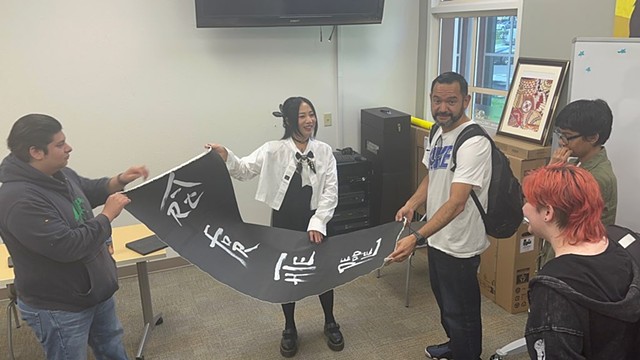 Artists Lin Fei Fei gifting my class a painting during her art talk at Woodland Community College.