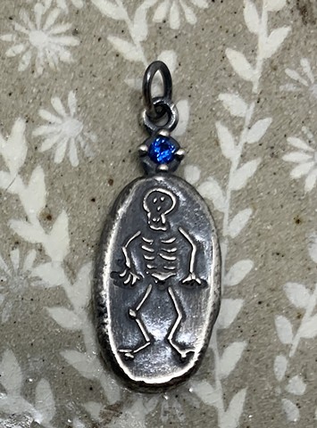 Skeleton Pendant with Lab Created Blue Sapphire