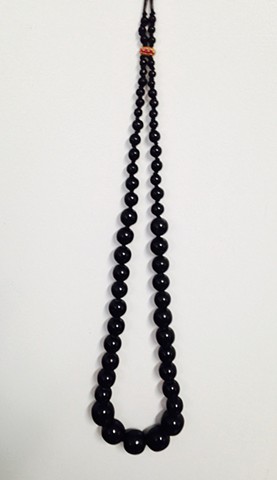 Knotted Black Graduated Bead Necklace with Bronze and Red Stone Clasp