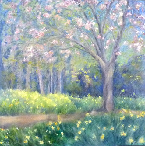 A soft, calming A soft spring landscape, with naturalized daffodils beneath a blossoming cherry tree