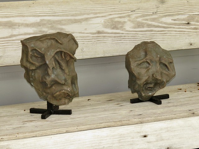 pair of bronze heads