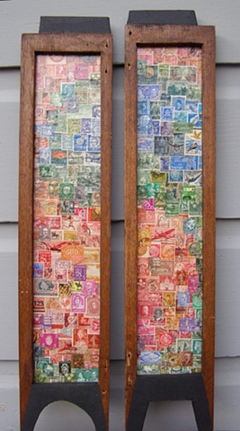 postage stamp art on wood panel